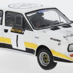 vieille voiture de rallye jaune et blanche