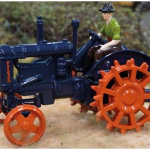 vieux tracteur agricole bleu et orange